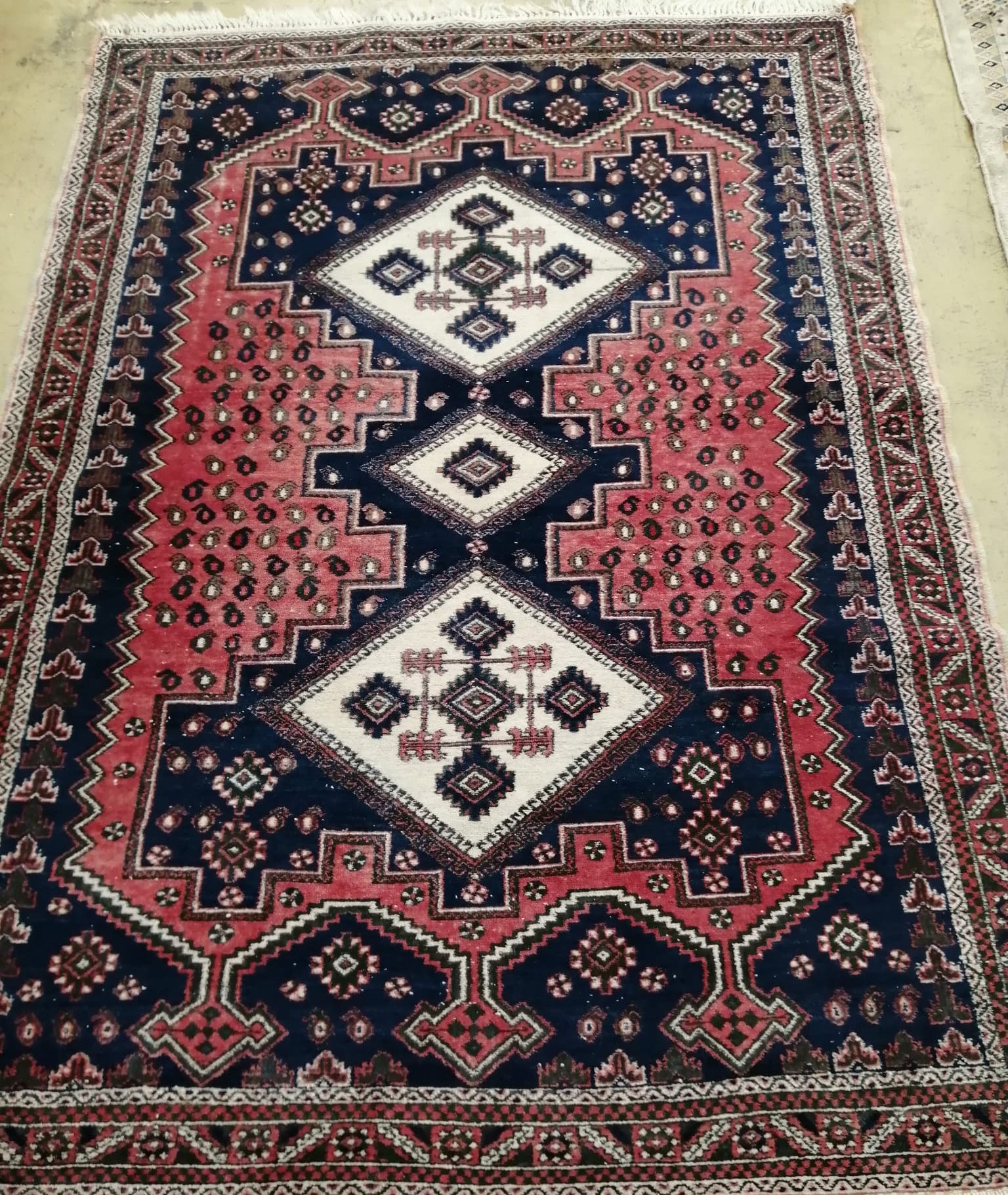 A Caucasian style blue and red ground rug, 180 x 130cm